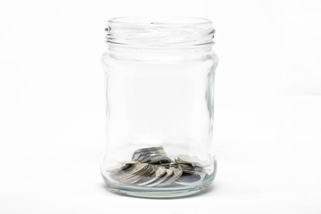 Coin in a jar on white background. Business financial and saving money concept.