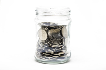 Coin in a jar on white background. Business financial and saving money concept.