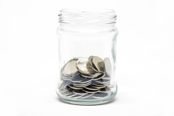 Coin in a jar on white background. Business financial and saving money concept.