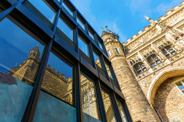 city hall of Aachen, Germany, reflects in windows
