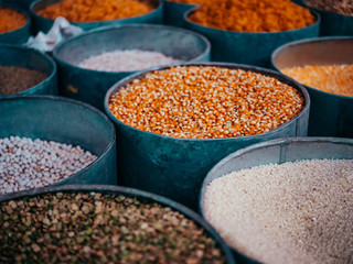 Moroccan food shop on a Market with corn, rice, peas and grain