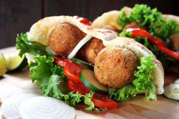 Falafel and fresh vegetables in pita bread
