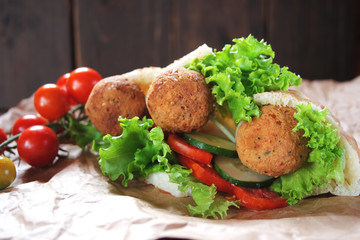 Falafel and fresh vegetables in pita bread
