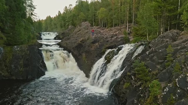 Aerial footage of a Karelian waterfall Kivach, full water stream main view, beautiful nature, foam on water