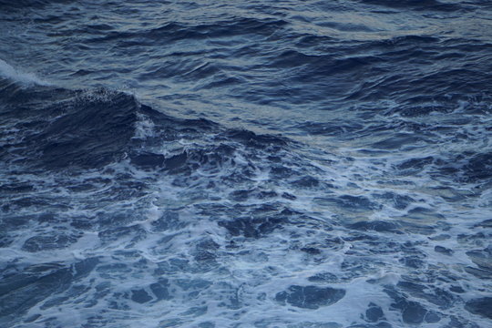 sunsets ocean blue sky clouds ocean waves sea © Stathie