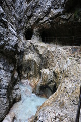 Mountain canyon river with hiking path and tunnels at Höllentalklamm
