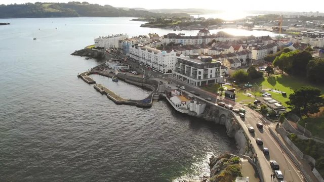 Drone flight at Sunset over Plymouth sea front.