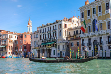 Naklejka na ściany i meble Gondola Ride on the Grand Canal in Venice Italy