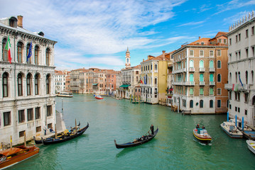 Obraz na płótnie Canvas Gondola and a motor boat on the Grand Canal in Venice Italy