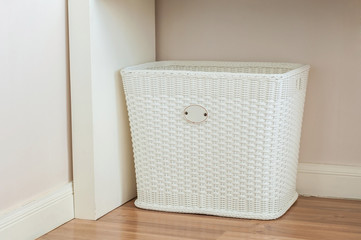 White Cloth basket on floor in room interior