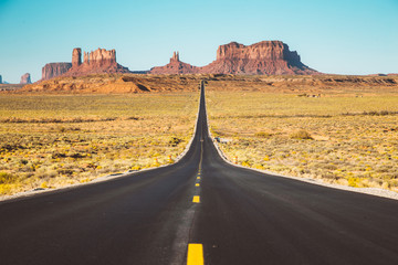 Classic highway view in Monument Valley at sunset, USA