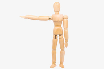 Wooden figure making stop gesture with her hand
