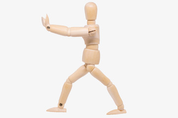 Wooden figure making stop gesture with her hand