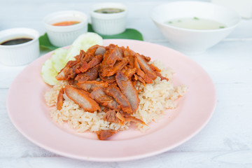 Barbecued red pork in sauce with rice