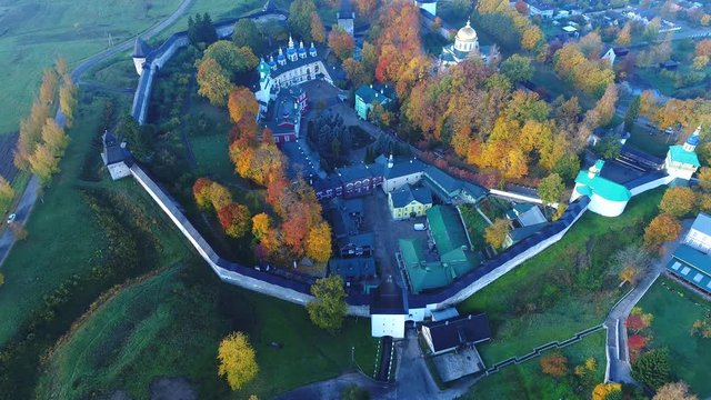 Holy Dormition Pskov-Pechersk monastery, October day (aerial video). Pechora, Russia