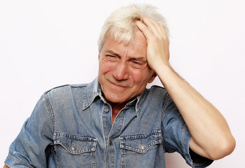 lifestyle, health and people concept: Senior man has headache, on white background