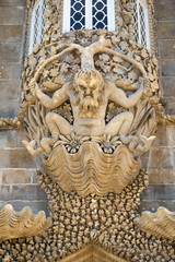 Decorative corbel in form of Triton under the oriel window in Pena Palace. Sintra. Portugal