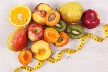 Fresh fruits containing nutritious vitamins for healthy lifestyles and centimeter, slimming concept