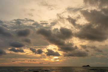 Morning sunrise beach with cloudy sky.