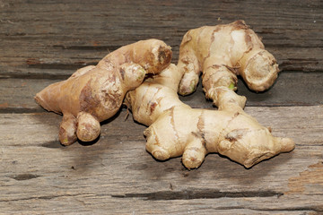 Fototapeta premium Ginger root on the wooden background