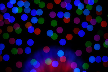 Colorful bokeh created by the fire in the night of the celebration. Make a happy smile