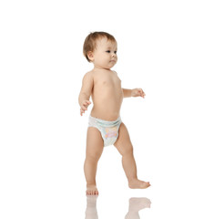 Infant child baby girl kid toddler in diaper  make first steps