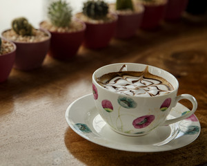 Cup of cappuccino on table