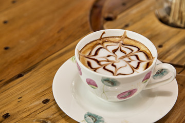 Cup of cappuccino on table