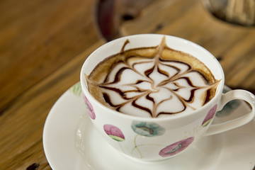 Cup of cappuccino on table