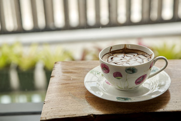 Cup of cappuccino on table