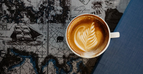 lattee coffe on world map background and copyspace, drink and beverage concept.