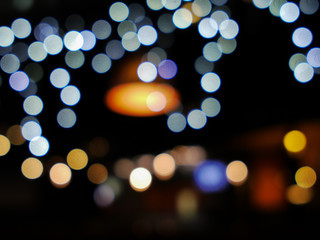 Bokeh with garlands and lamp in club, soft focus