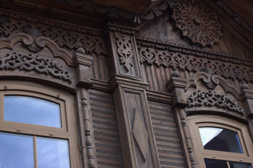 A wooden house decorated with carving