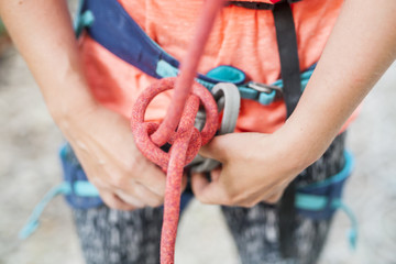 A climber knits a knot.