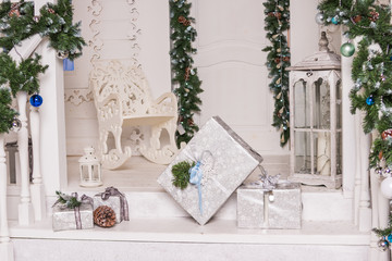 Preparing for New year, packaging gifts. gifts boxes, pompom, decoration tape, ribbons.Christmas background with gift box, white and silver ornaments. New year greeting card, copy space.