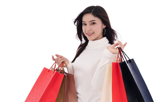 happy woman holding shopping bag isolated on a white background