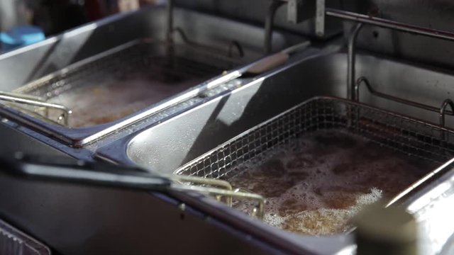 Slow Motion shot of fries cooking in a deep fryer.
CAMERA: Canon 5D MkIV