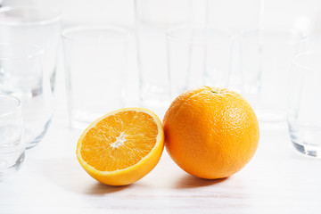Fresh sliced orange with glass