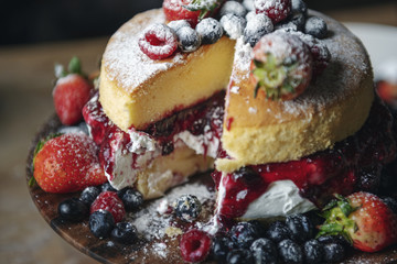 Closeup of a layered cake with berries
