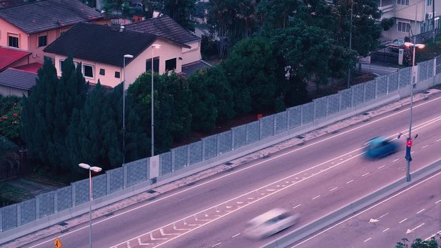 Day to night timelapse of cars driving on highway