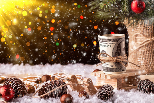 Money Christmas Gift with wooden sled. Christmas concept