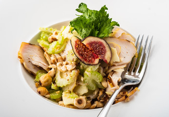 Grilled chicken breast salad with figs, green apple, celery, nuts and Parmesan.