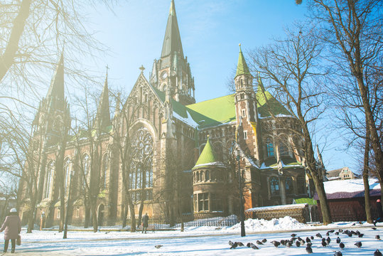 old gothic church in winter day with blue sky