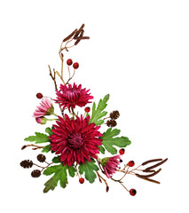 Purple chrysanthemum flowers and autumn dry twigs in a corner arrangement
