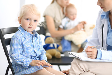 Obraz premium Doctor and a little blonde girl. Medicine and healthcare concept