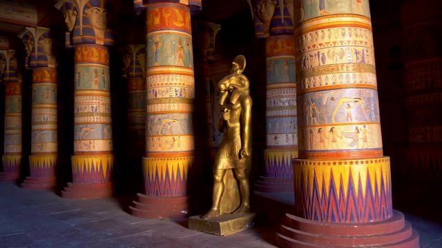 Egyptian palace filled with colourful columns and a statue of Khnum, the ram-headed Egyptian god of the source of the Nile. 4K, UHD