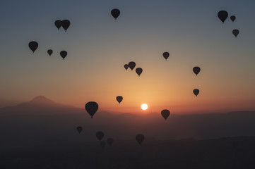 Hot air balloon flying over spectacular Cappadocia