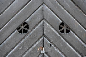 an old wood door with metal handle