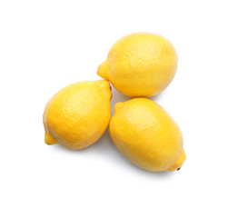 Whole ripe lemons on white background