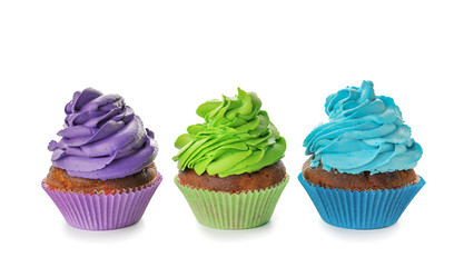 Delicious colorful cupcakes on white background